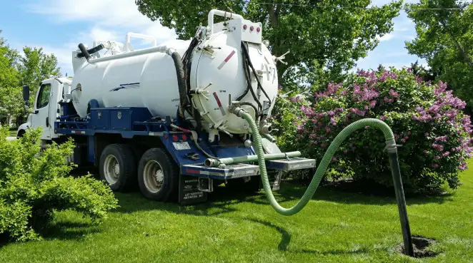 Professional vacuum truck performing residential drainage and septic maintenance in Fort Collins, CO